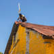 Image for article titled An artist has painted mosques and churches across Kenya yellow to promote peace